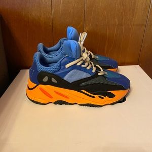 Size 6 1/2 orange, blue, and black Adidas not authentic